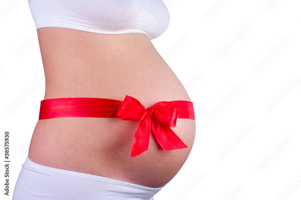 red bow around belly of young pregnant woman red bow around belly of young pregnant woman