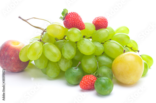 bunch of white grapes, peach and yellow plum isolated on white