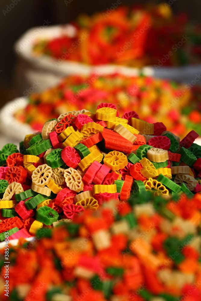 Fototapeta premium Multicolored pasta in traditional market in India.