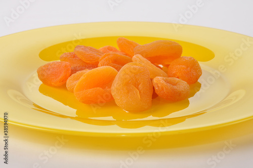 Dried apricotes on plate