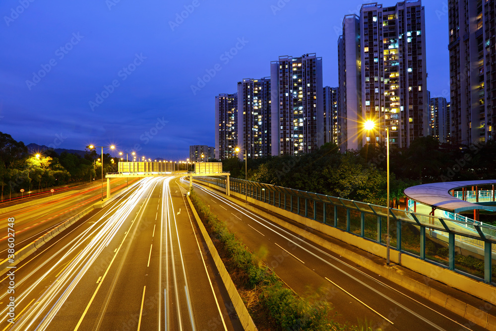 car light trails in modern city