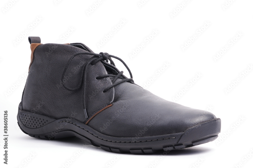 Single black boot isolated over white background. Single black boot isolated over white background.
