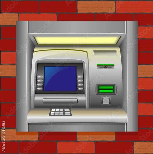 atm on a brick wall