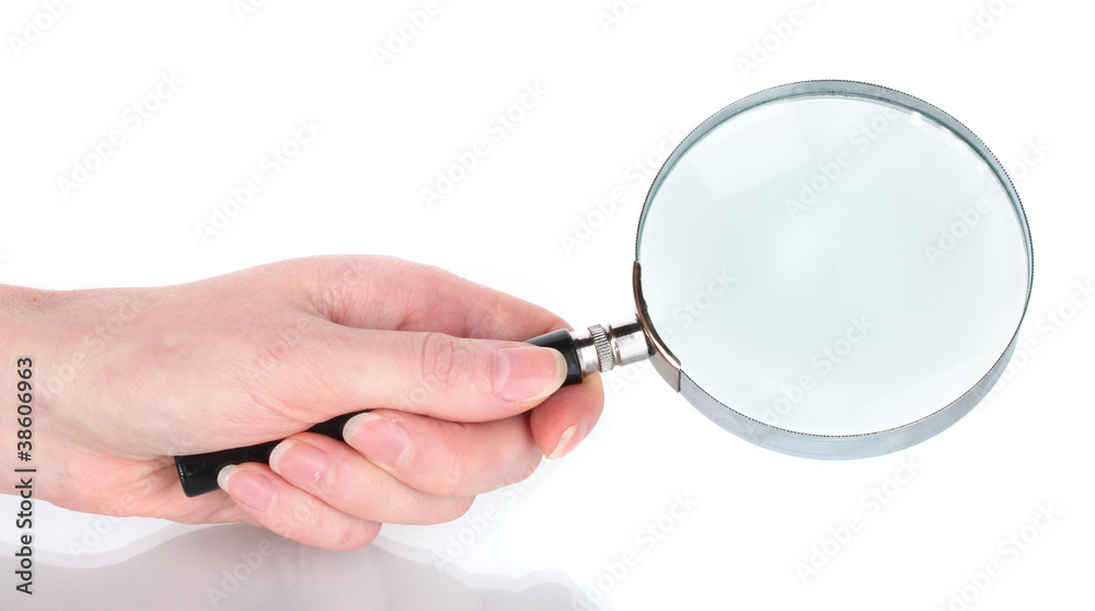 Magnifying glass in hand isolated on white Magnifying glass in hand isolated on white