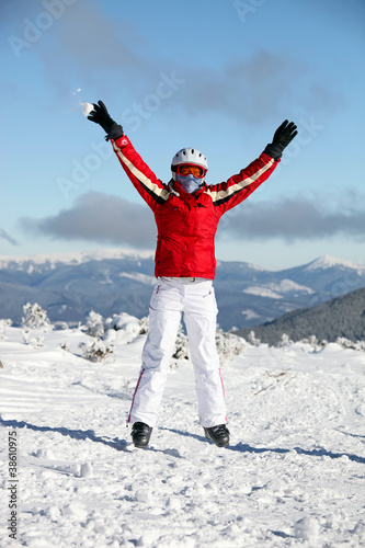 Portrait of happy female skier on slope