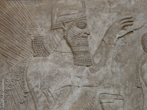 Ancient Assyrian wall carving of a man