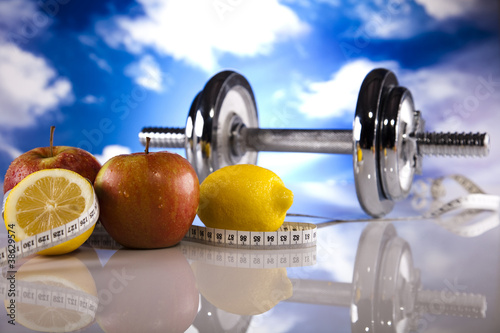 Fitness, dumbell and blue sky