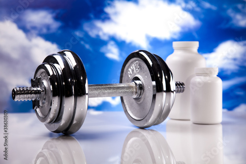 Fitness, dumbell and blue sky