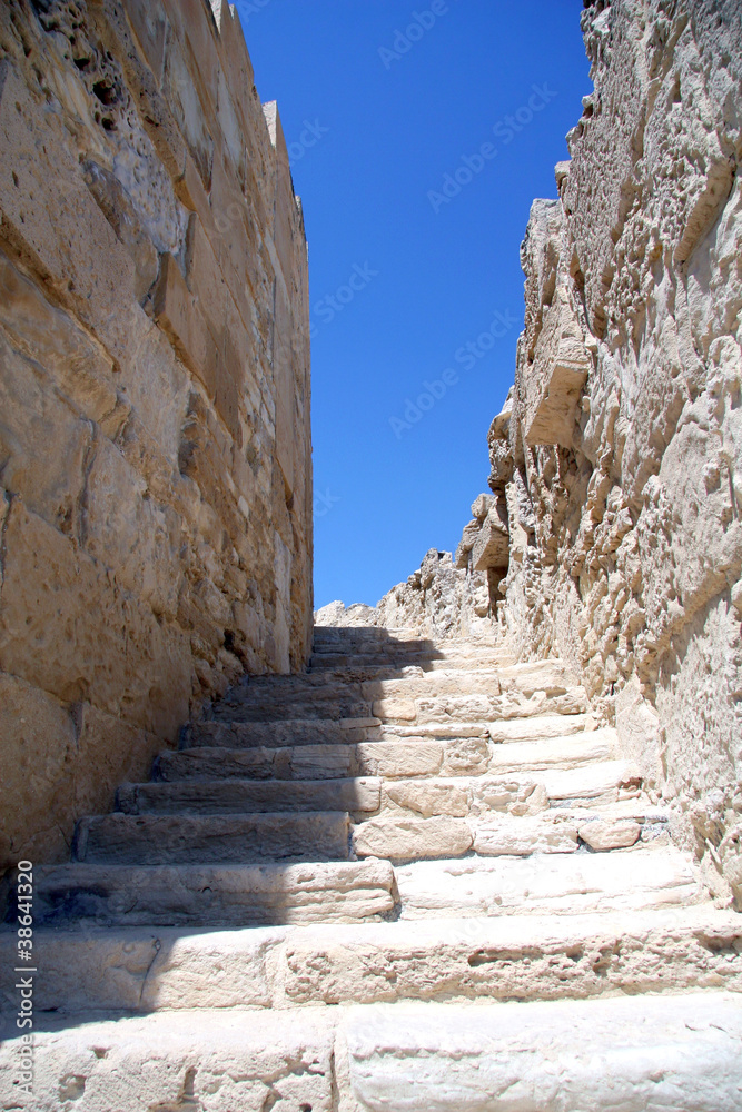 A stone stairway up against the blue sky