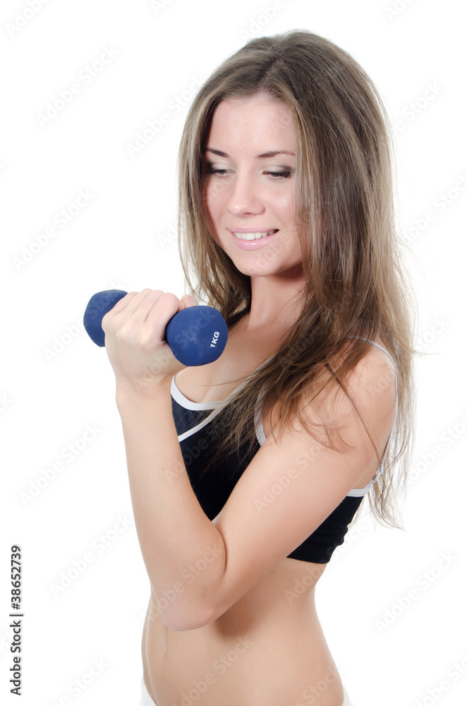 The girl does exercises with dumbbells The girl does exercises with dumbbells