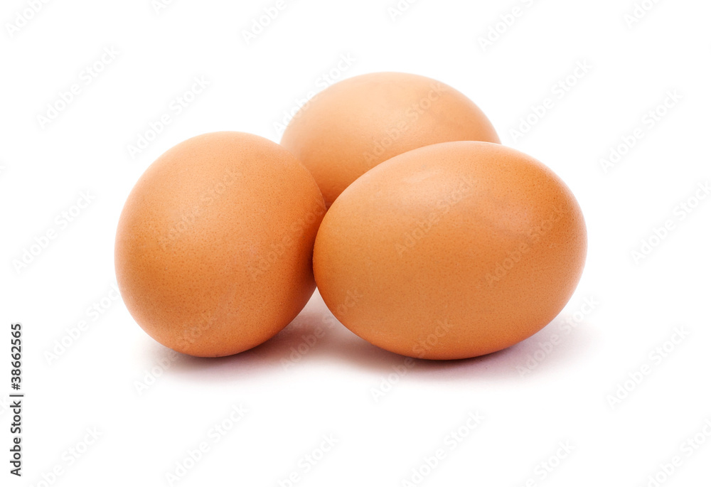 Three brown eggs on white background Three brown eggs on white background