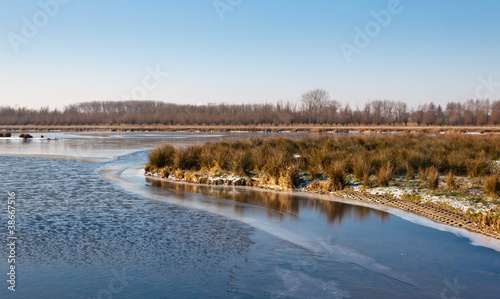 Water and ice on the surface of a natural pond