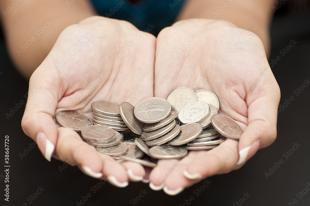 Female hands with coins