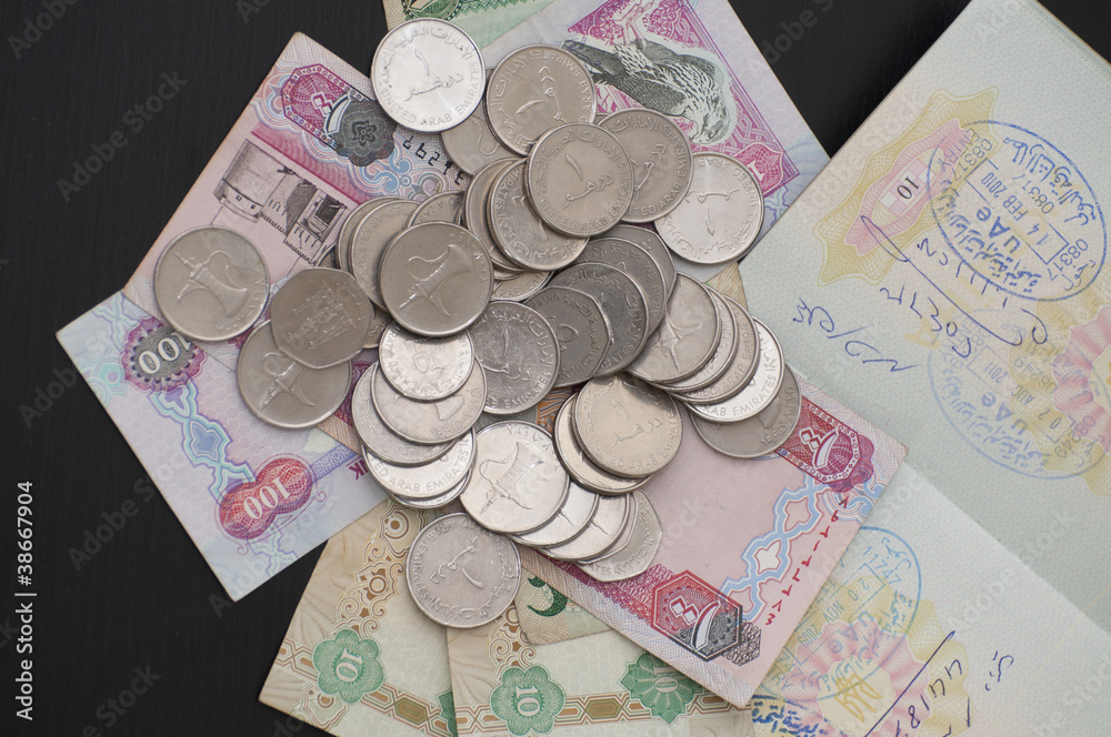 UAE money and entry stamp in passport