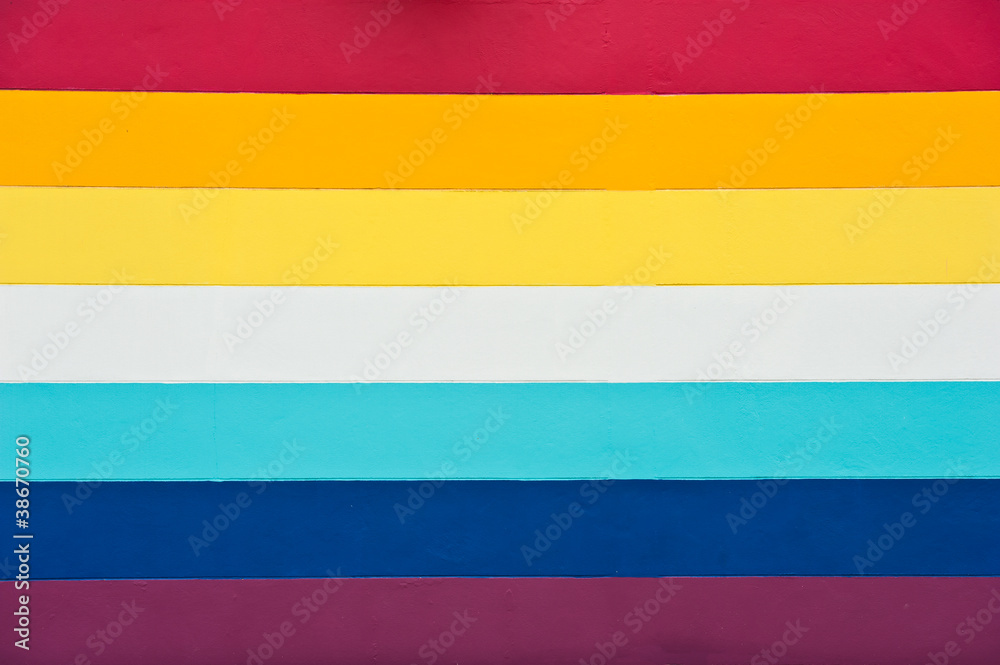 Fototapeta premium Rainbow color background with texture on a wall