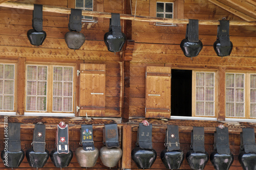 Fotografija Swiss cow bells hanging outside traditional chalet