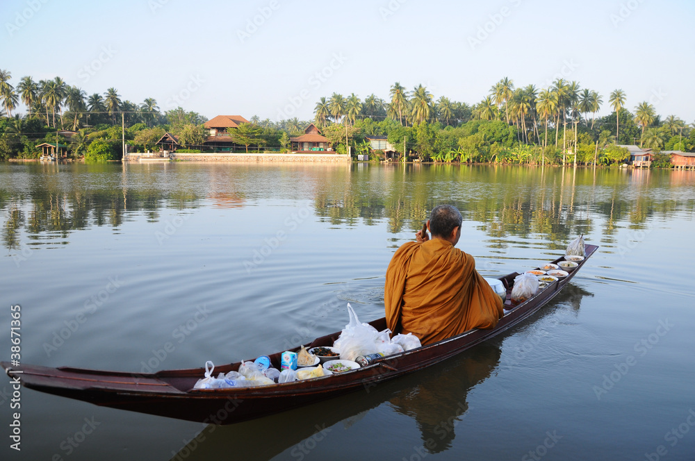 Buddhist monk in boat