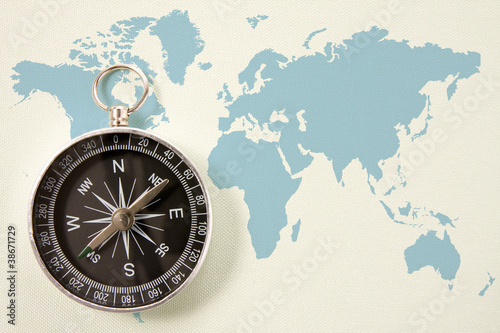 black compass on blue world map