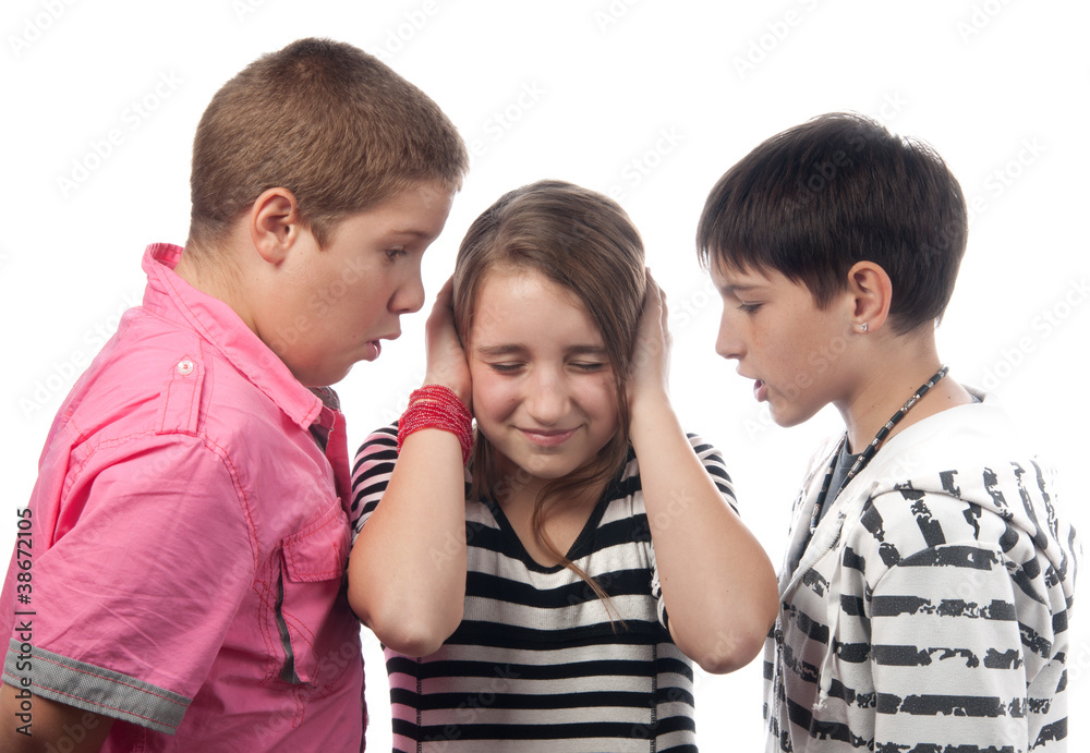 Two angry teenage boys harassing frightened girl Two angry teenage boys harassing frightened girl