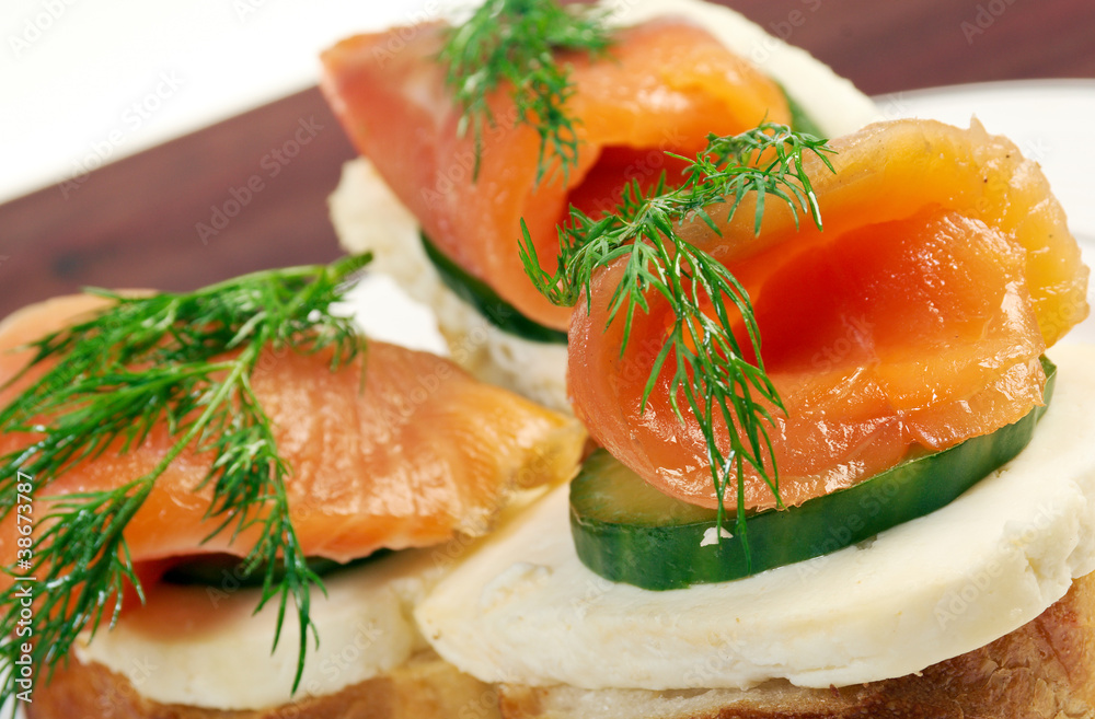 Canapes with smoked salmon cheese and cucumber Canapes with smoked salmon cheese and cucumber