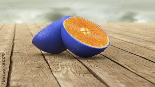 blue skin orange on wooden table photo
