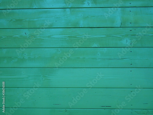 BACKGROUND OF GREEN PAINTED WOODEN PANEL