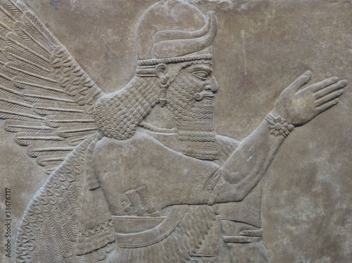Ancient Assyrian wall carving of a man