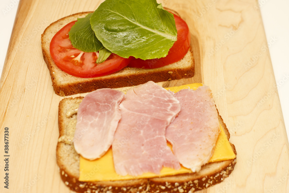 Ham and Cheese Sandwich Open on Cutting Board Ham and Cheese Sandwich Open on Cutting Board