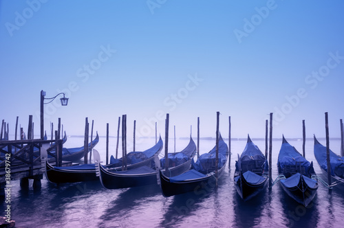 Gondolas in the morning fog, Venice - Italy © fazon
