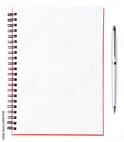 Silver ballpoint pen and blank page of a notebook with binder
