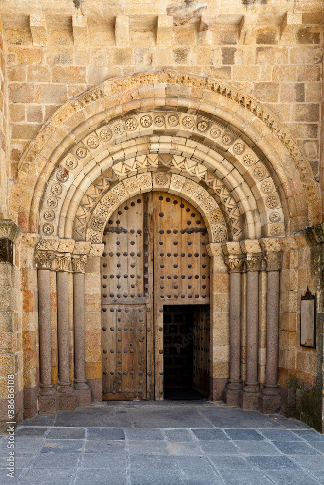 Open Old Church Door with Stone Arches and Columns
