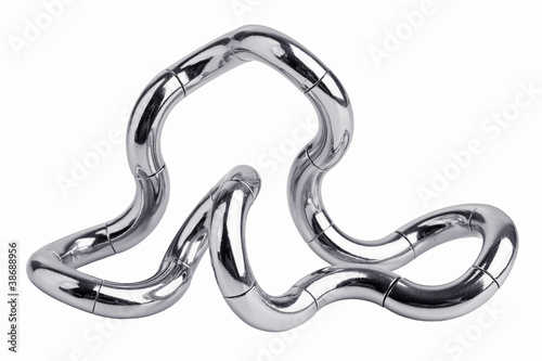 Metal puzzle in the form of a curve photo