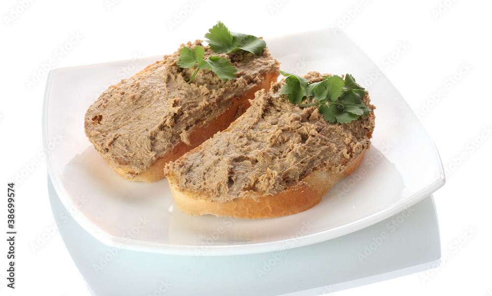 Fresh pate on bread on white plate isolated on white Fresh pate on bread on white plate isolated on white