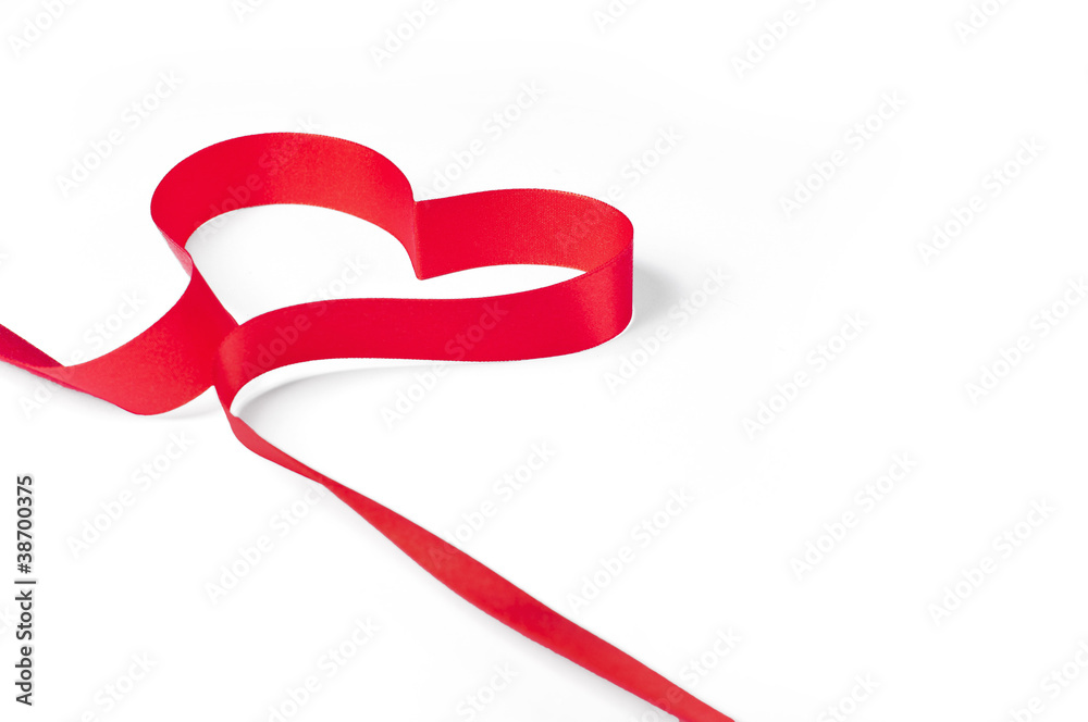 Red ribbon shaped as a heart isolated on white