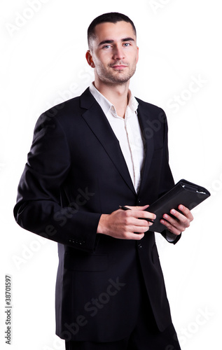 Elegant young businessman with notebook isolated on white