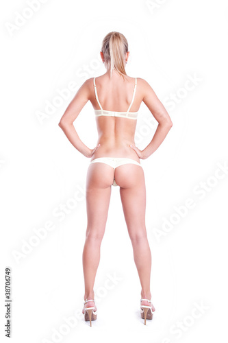 Sensual young woman with beautiful body posing