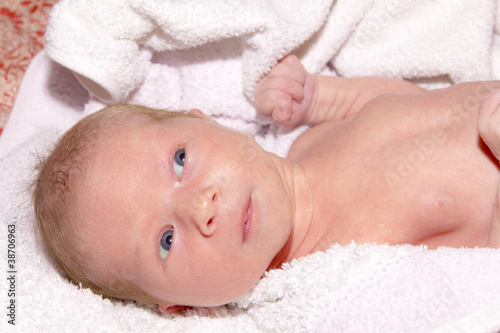 newborn infant is bathed in the bath © kaparulin