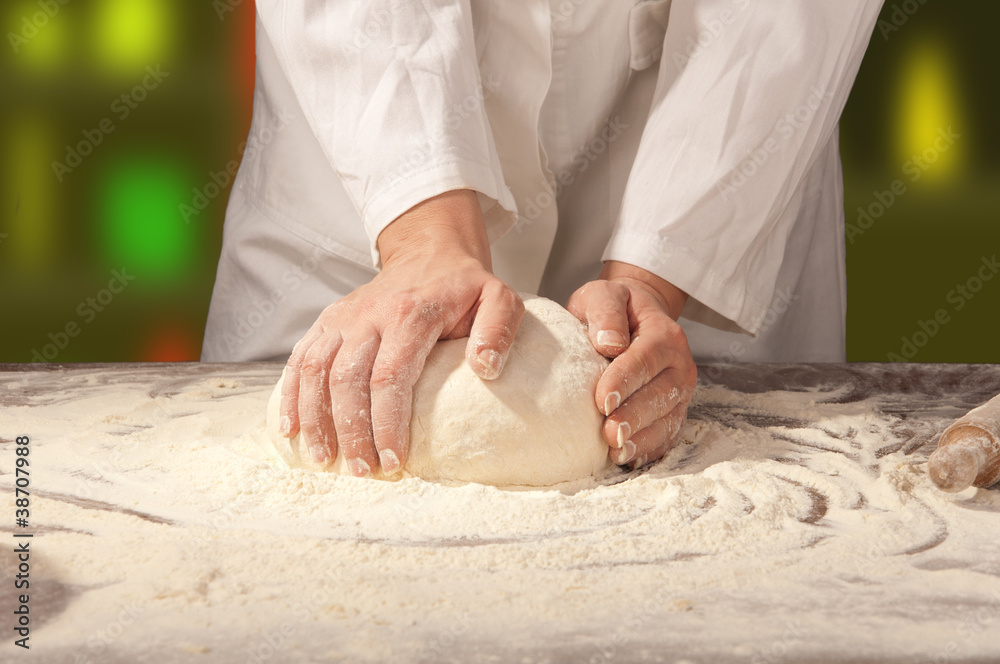 Fototapeta premium hands kneading bread dough
