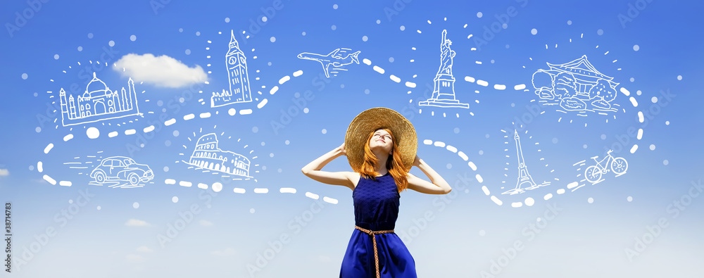 Redhead girl dreaming about traveling around the world.