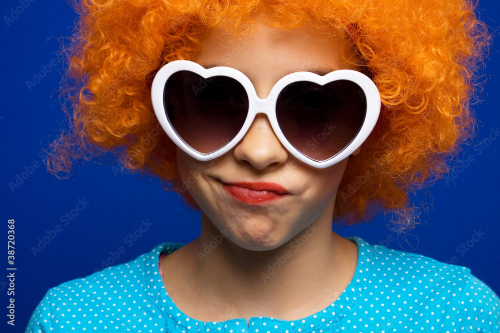 Young girl with orange party wig Young girl with orange party wig