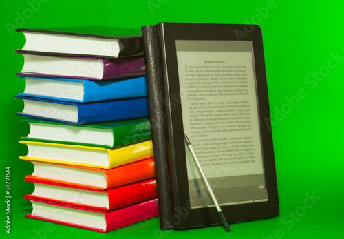 Obraz na płótnie E-book reader with stack of printed books w salonie