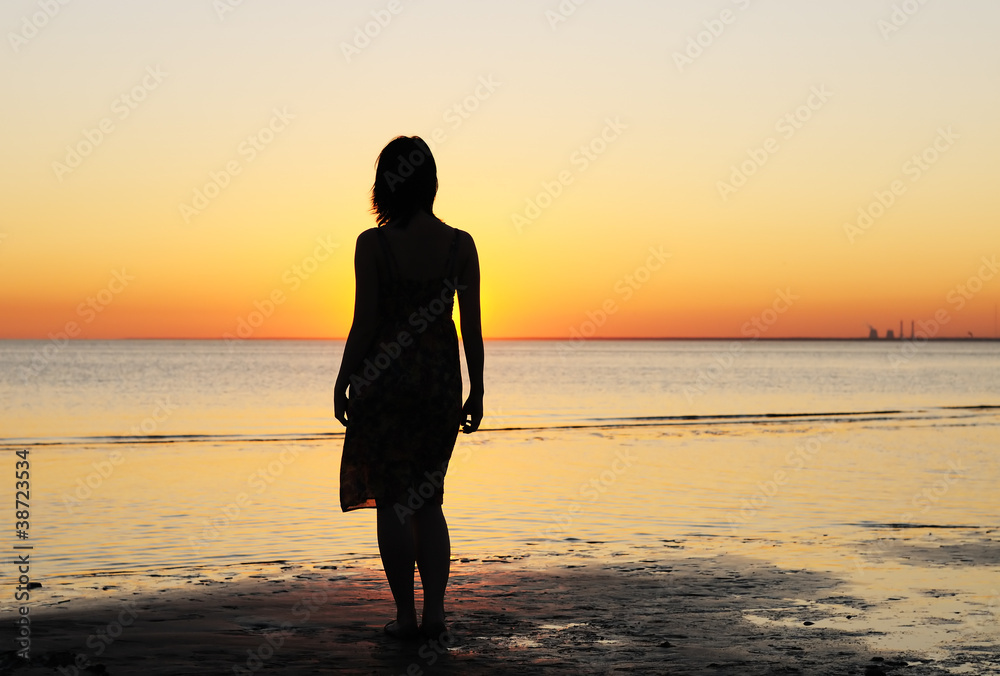 Portrait of young woman as silhouette by the sea Portrait of young woman as silhouette by the sea