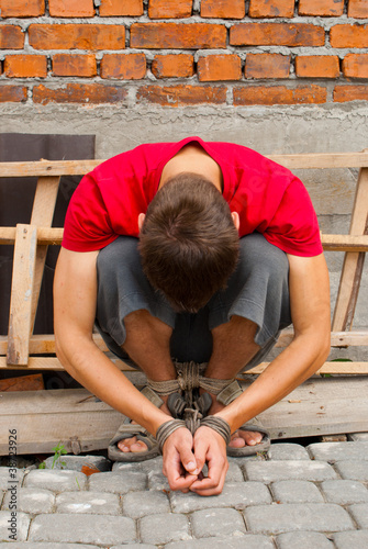 Man tied up with rope