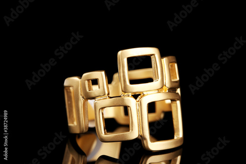 beautiful gold ring on black background