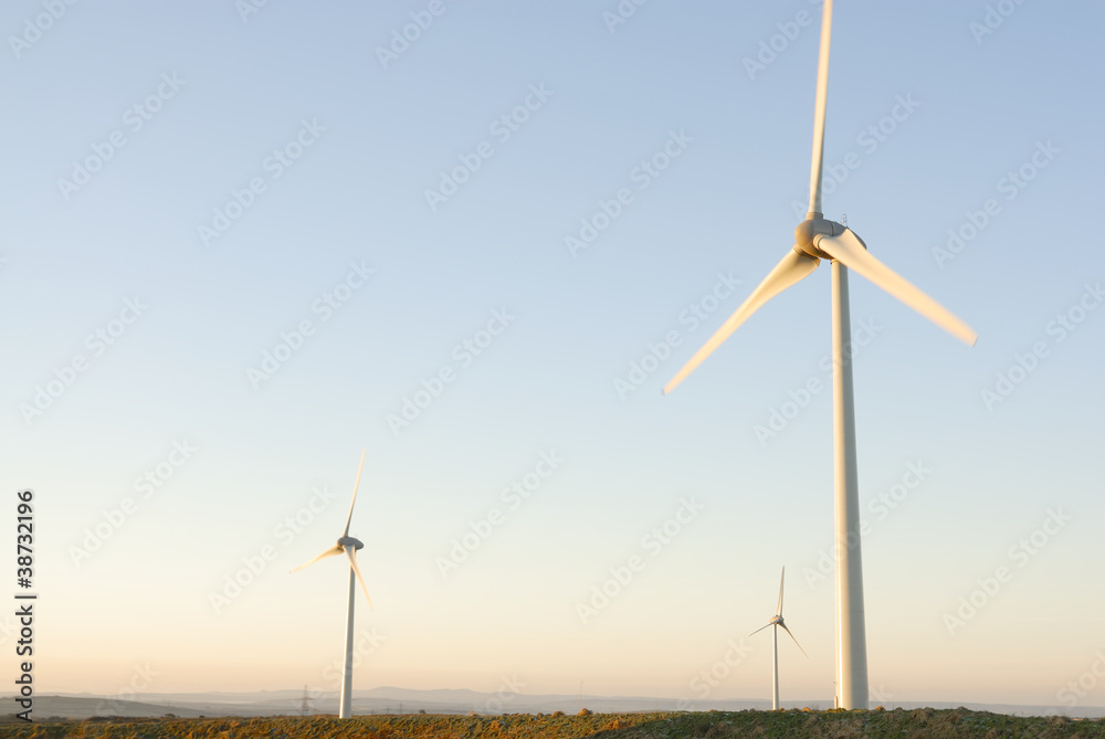 Three Wind Turbines at Dawn, UK.