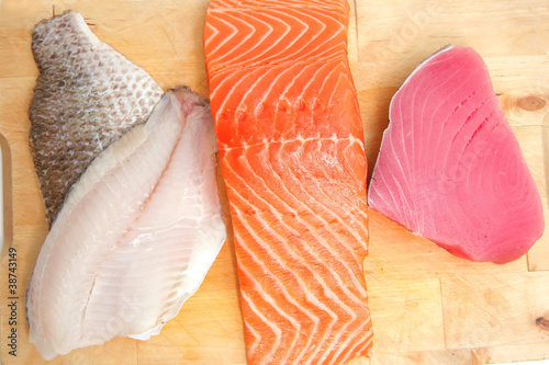 salmon , red tuna , and sole fish pieces