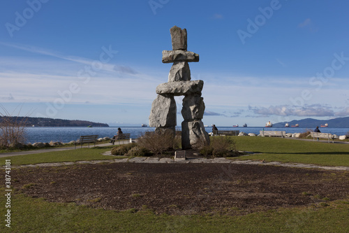 Inukshuk with english bay behind, vancouver