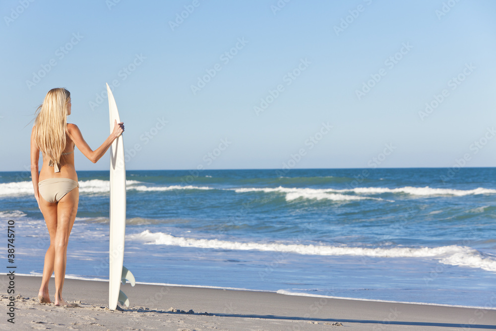 Beautiful Woman Surfer In Bikini With Surfboard At Beach