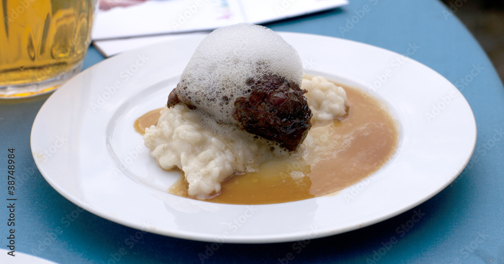 Glazed cheek of Iberian pork in sherry and cream with rice and m Glazed cheek of Iberian pork in sherry and cream with rice and m