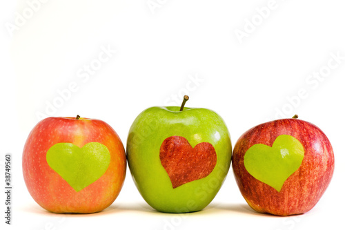 three apples with hearts